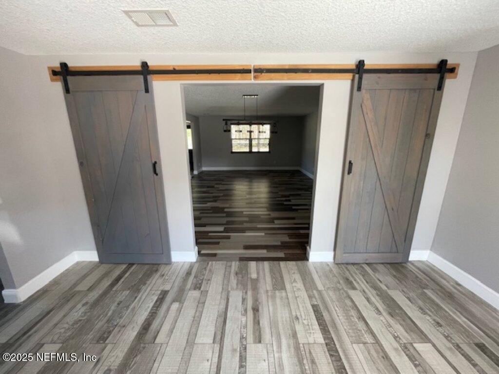 14014 Lem Turner Road Jacksonville, FL 32218 - Photo 16 of 25 a view of wooden floor in an empty room