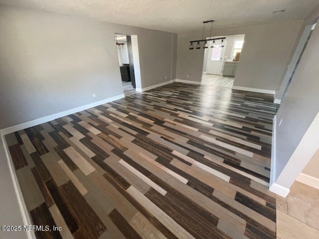 14014 Lem Turner Road Jacksonville, FL 32218 - Photo 17 of 25 a view of empty room with wooden floor
