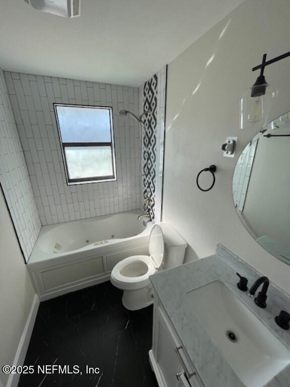 14014 Lem Turner Road Jacksonville, FL 32218 - Photo 22 of 25 a bathroom with a sink a toilet and a bathtub