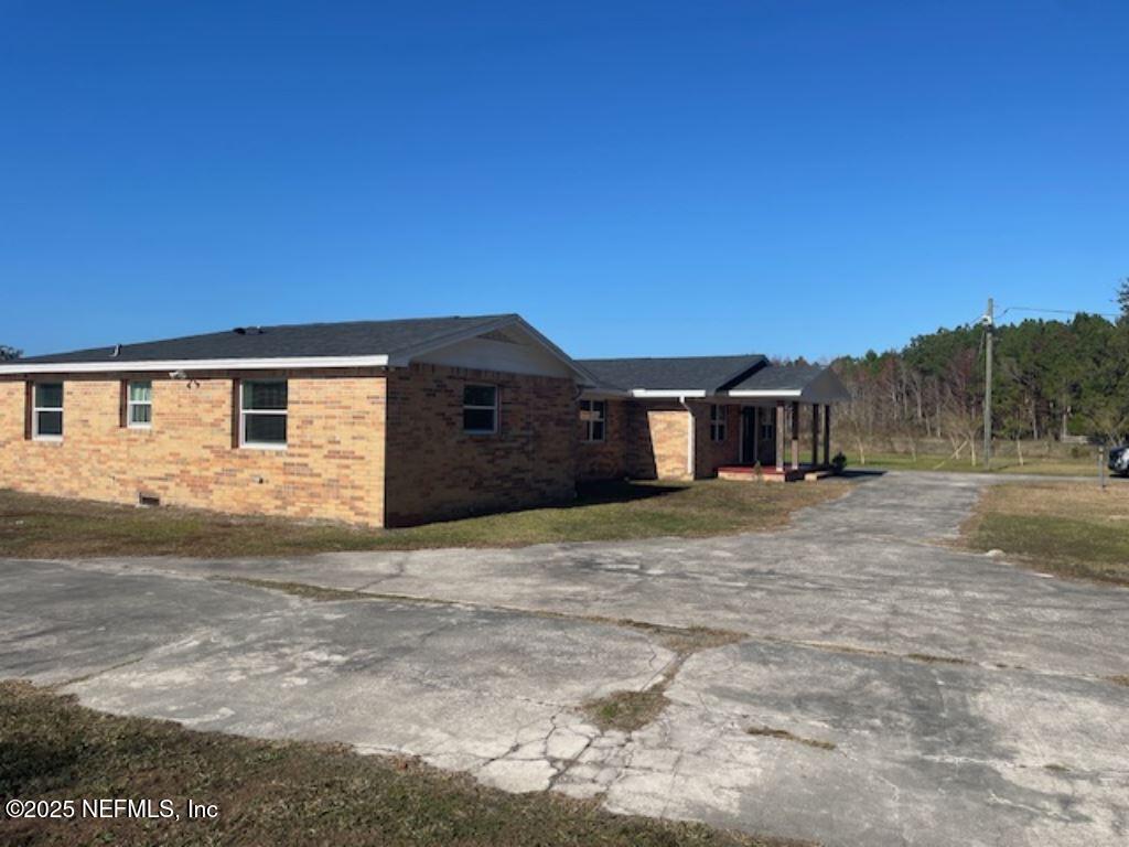 14014 Lem Turner Road Jacksonville, FL 32218 - Photo 3 of 25 a house view with a outdoor space