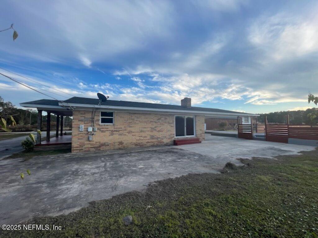 14014 Lem Turner Road Jacksonville, FL 32218 - Photo 4 of 25 a view of a house with backyard and sitting area
