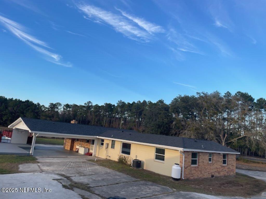 14014 Lem Turner Road Jacksonville, FL 32218 - Photo 5 of 25 a front view of a house with a yard