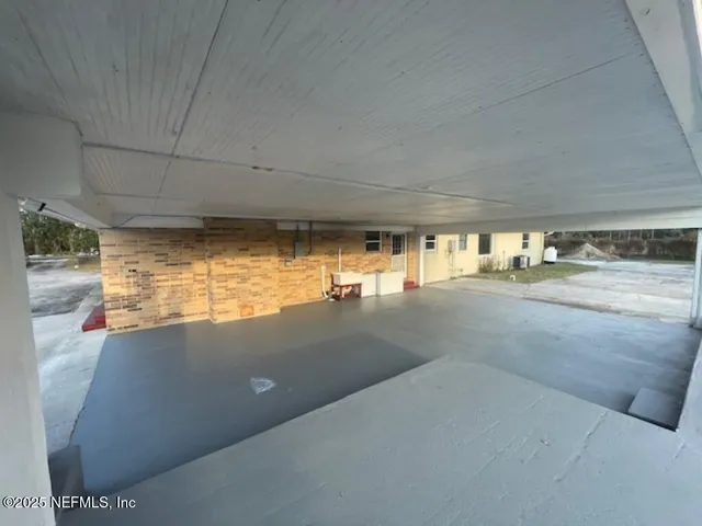 a front view of house with a garden