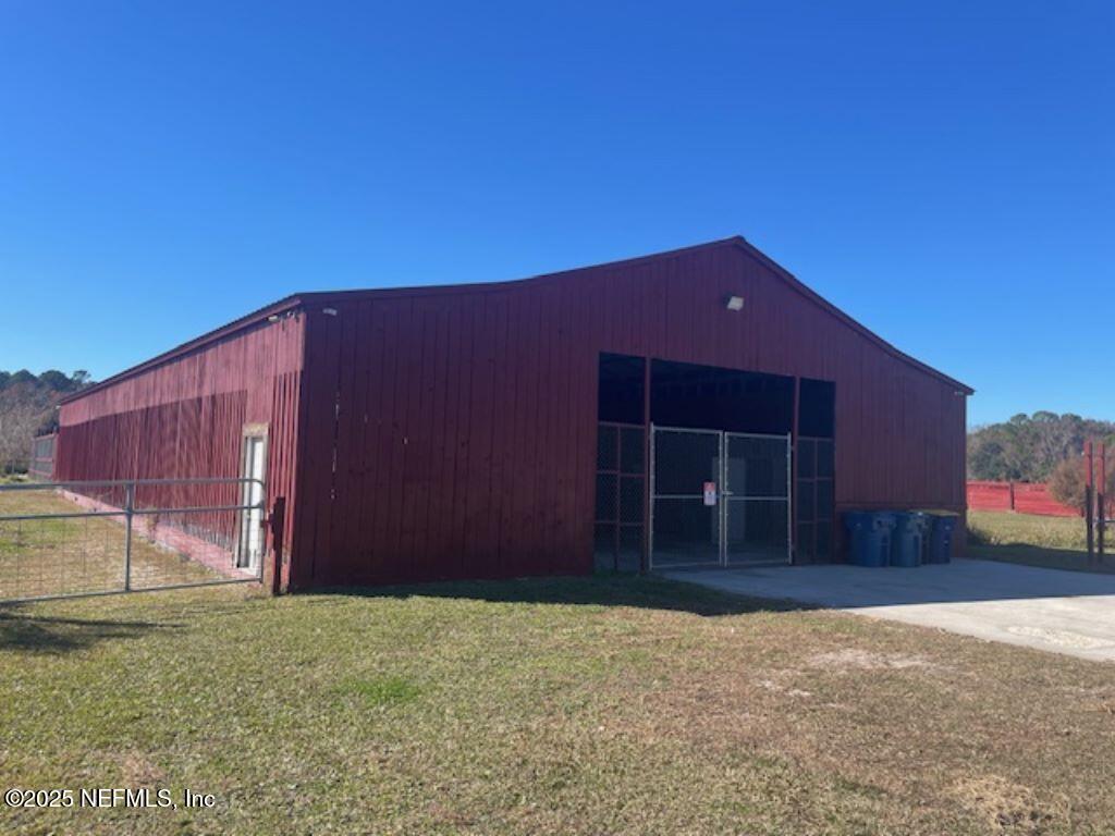 14014 Lem Turner Road Jacksonville, FL 32218 - Photo 7 of 25 a front view of house with a garden