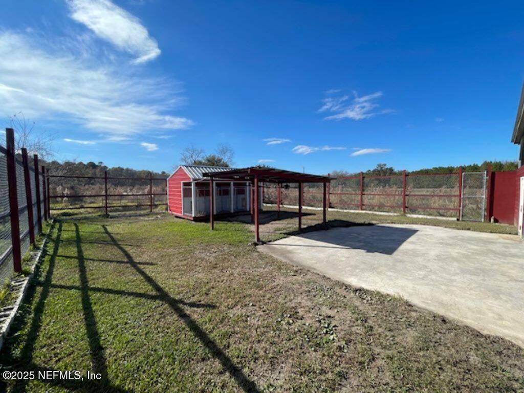 14014 Lem Turner Road Jacksonville, FL 32218 - Photo 9 of 25 a view of a backyard