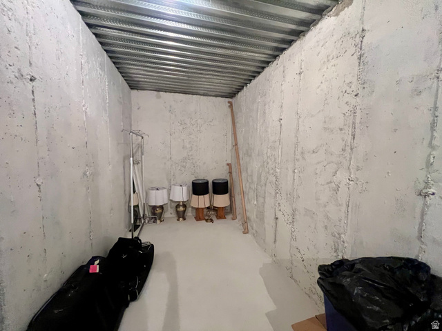 369 Culross Circle Tooele, UT 84074 - Photo 33 of 54 Unfinished room featuring concrete walls and a metal ceiling