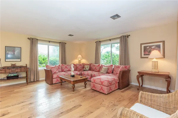 a living room with furniture and a window