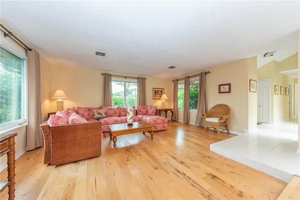 a living room with furniture and a window
