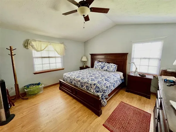 a bedroom with a bed and window