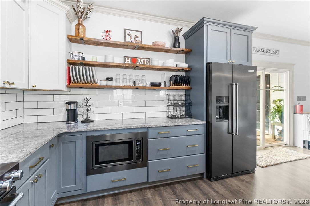 5535 Butler Nursery Road Fayetteville, NC 28306 - Photo 15 of 50 a kitchen with stainless steel appliances granite countertop a refrigerator and a sink
