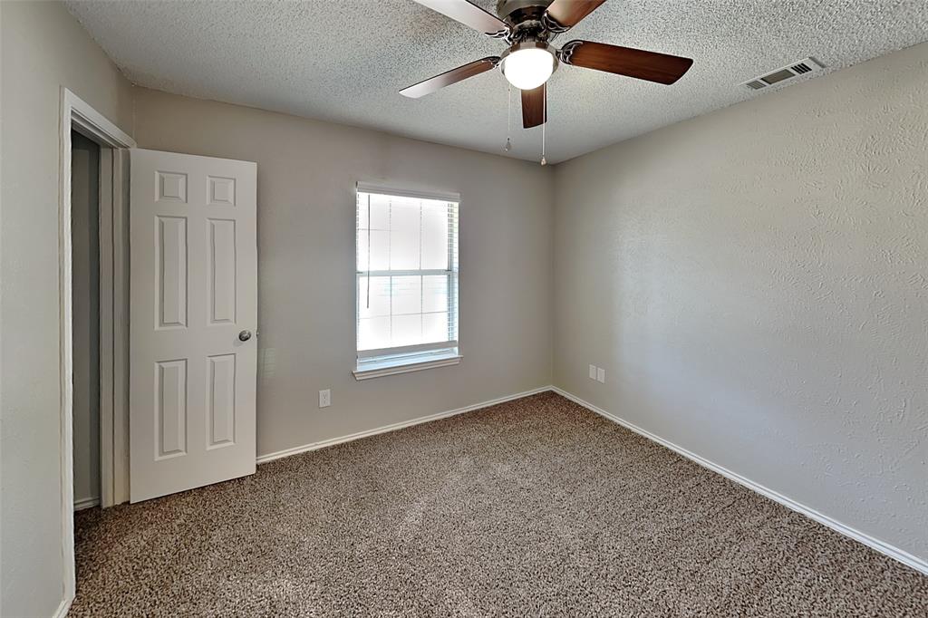 604 Ashby Place Allen, TX 75002 - Photo 14 of 21 an empty room with windows and fan