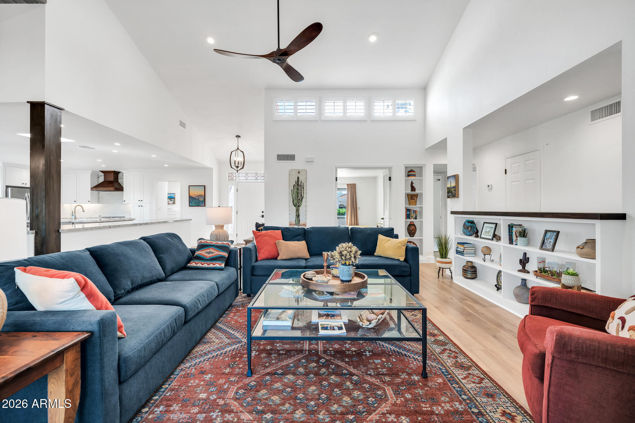 26229 East Marquis Lane Rio Verde, AZ 85263 - Photo 13 of 50 a living room with furniture kitchen view and a chandelier