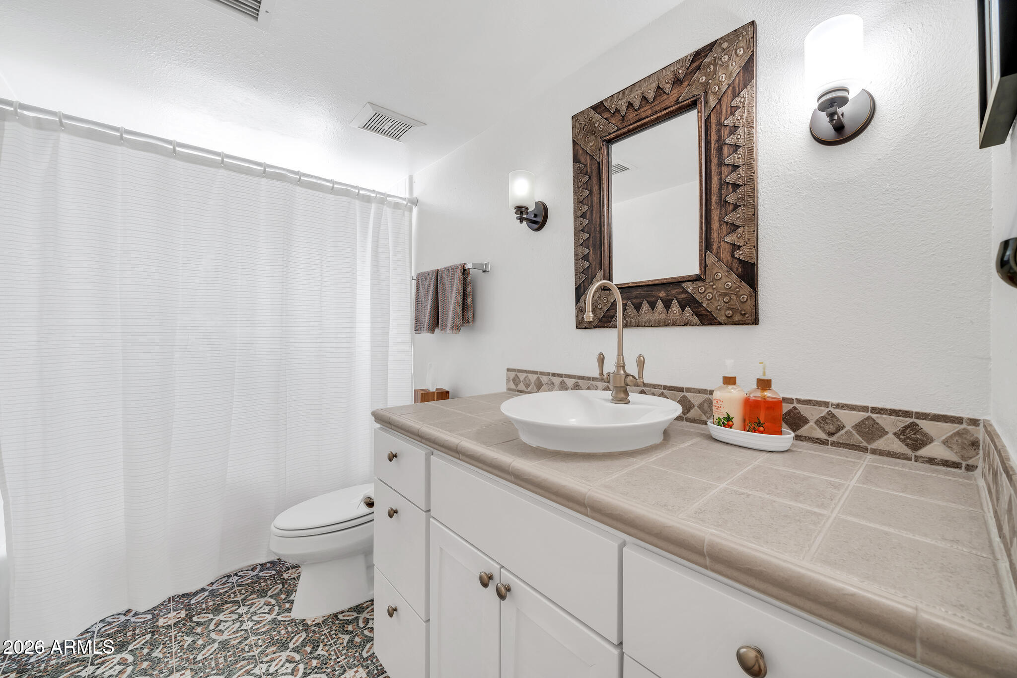 26229 East Marquis Lane Rio Verde, AZ 85263 - Photo 31 of 50 a bathroom with a toilet sink and mirror