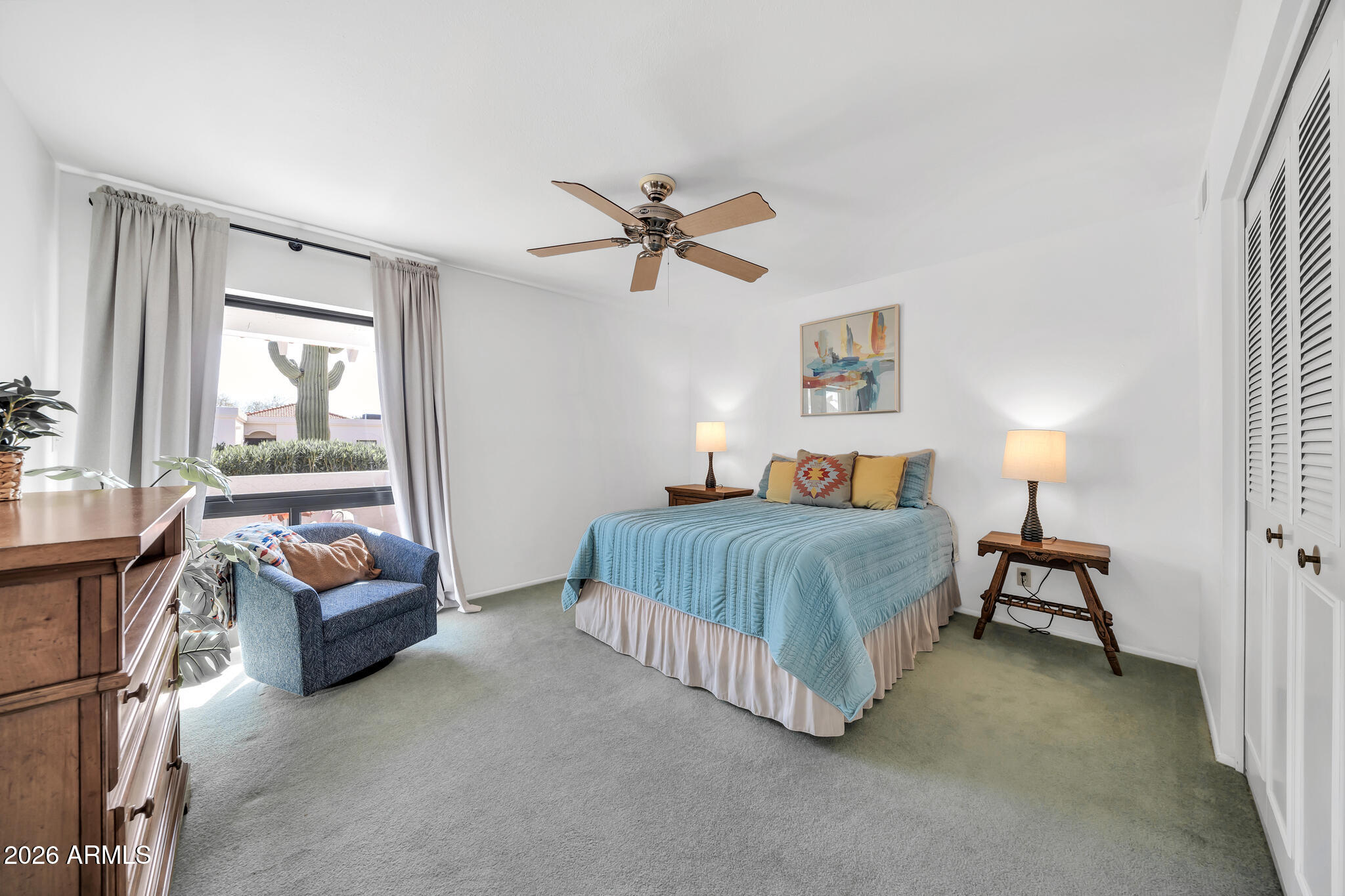 26229 East Marquis Lane Rio Verde, AZ 85263 - Photo 33 of 50 a bedroom with a bed and a chandelier