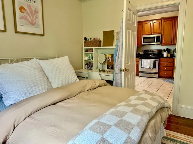 a bed room with a bed and a television