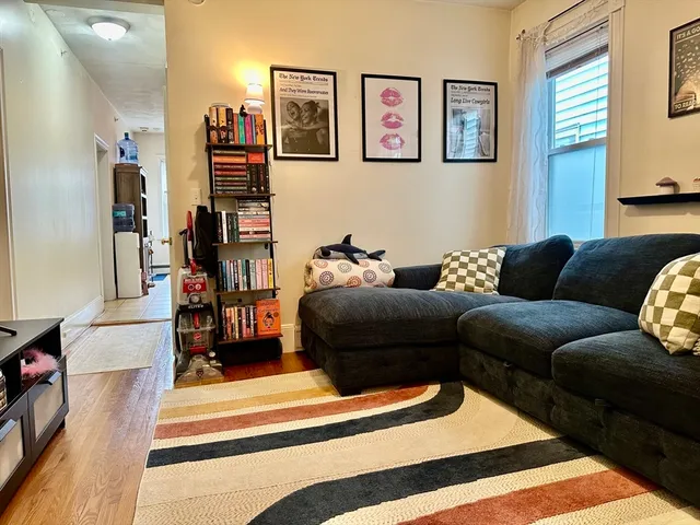 a living room with furniture and a rug