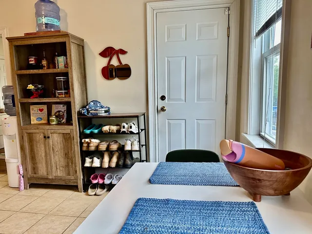 a living room with lots of furniture and a rug