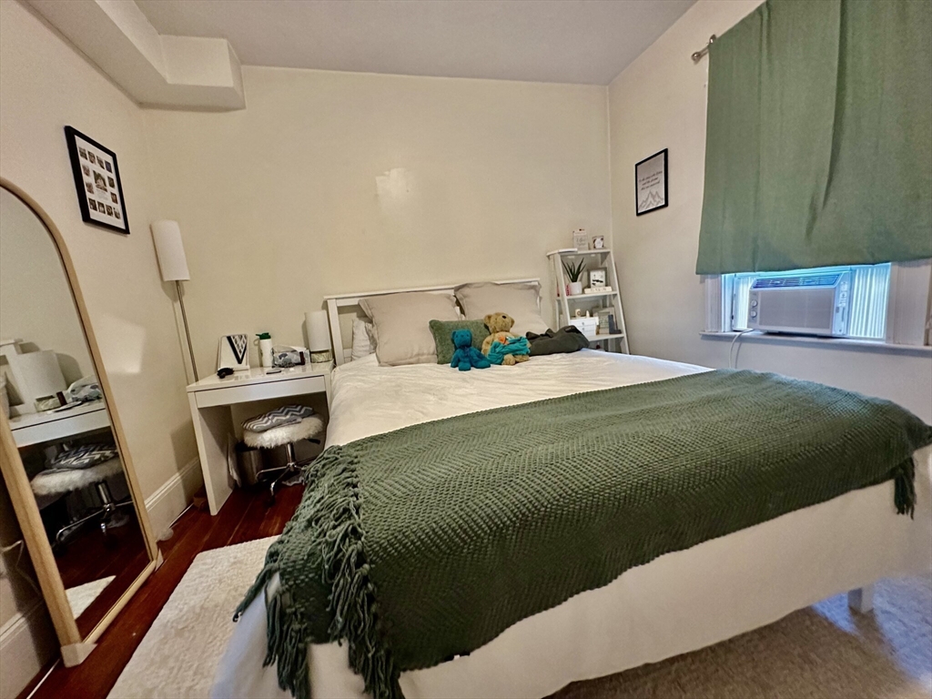 12-14 Marcella Street, Unit 2 Cambridge, MA 02141 - Photo 4 of 23 a bedroom with a bed next to a window with the outer view