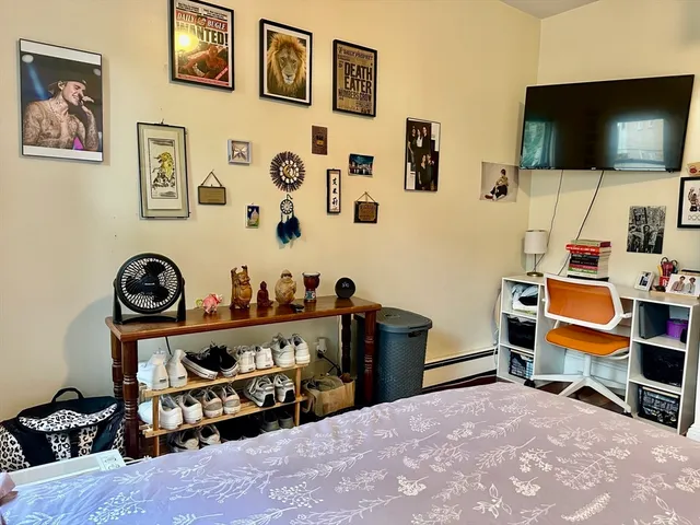 a room with chair and a flat screen tv