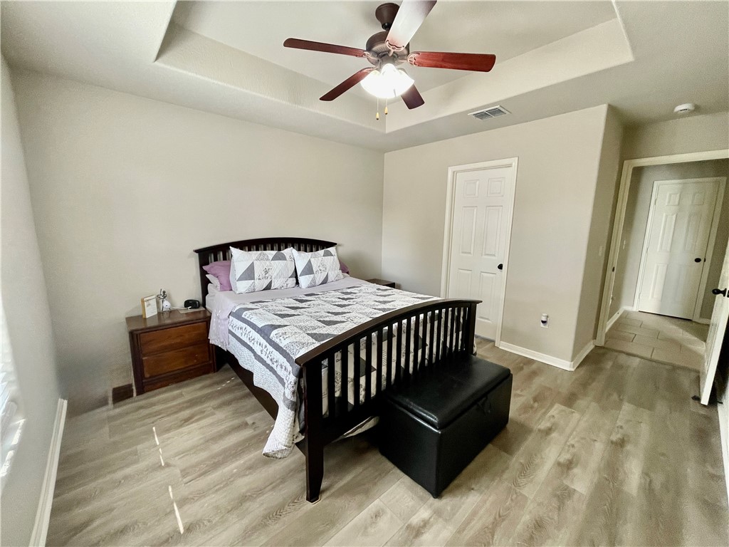 103 Sandollar Circle Fulton, TX 78382 - Photo 12 of 25 a bedroom with a bed and wooden floor