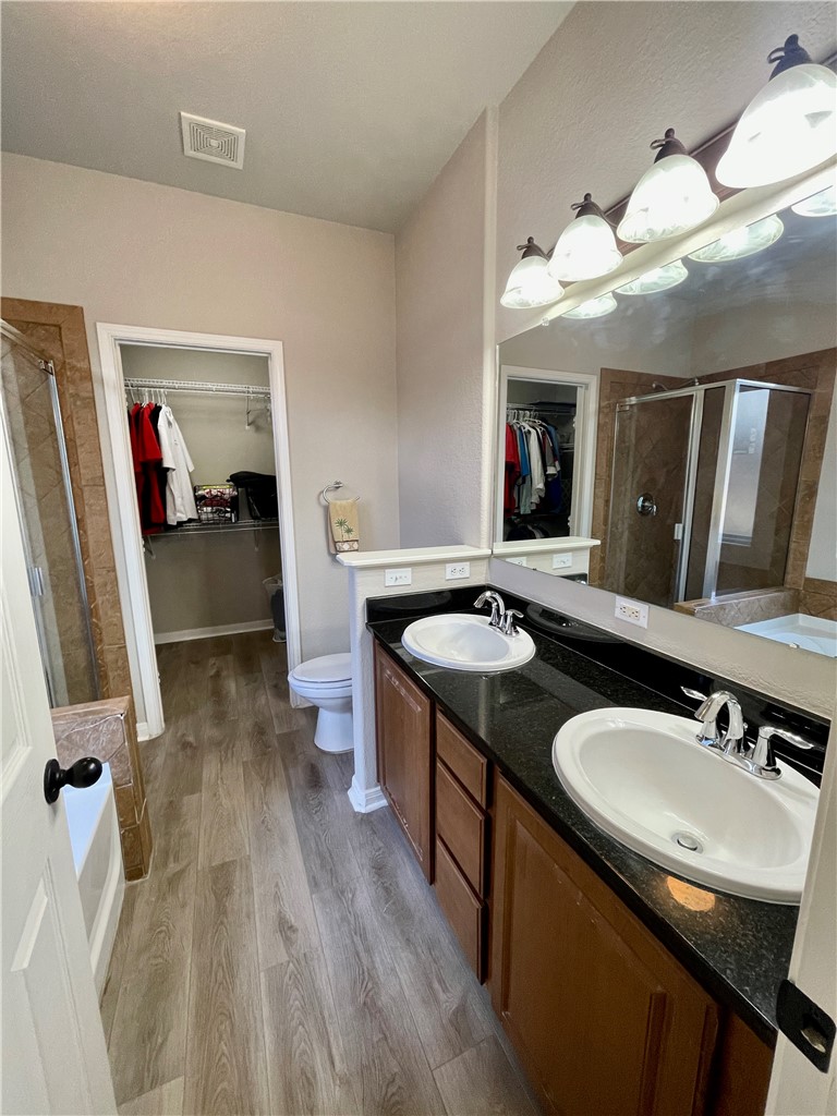 103 Sandollar Circle Fulton, TX 78382 - Photo 13 of 25 a bathroom with a sink double vanity granite and a mirror