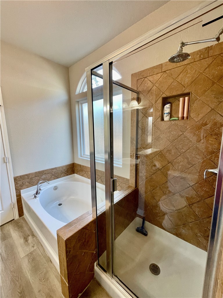 103 Sandollar Circle Fulton, TX 78382 - Photo 15 of 25 a bathroom with a tub and a shower