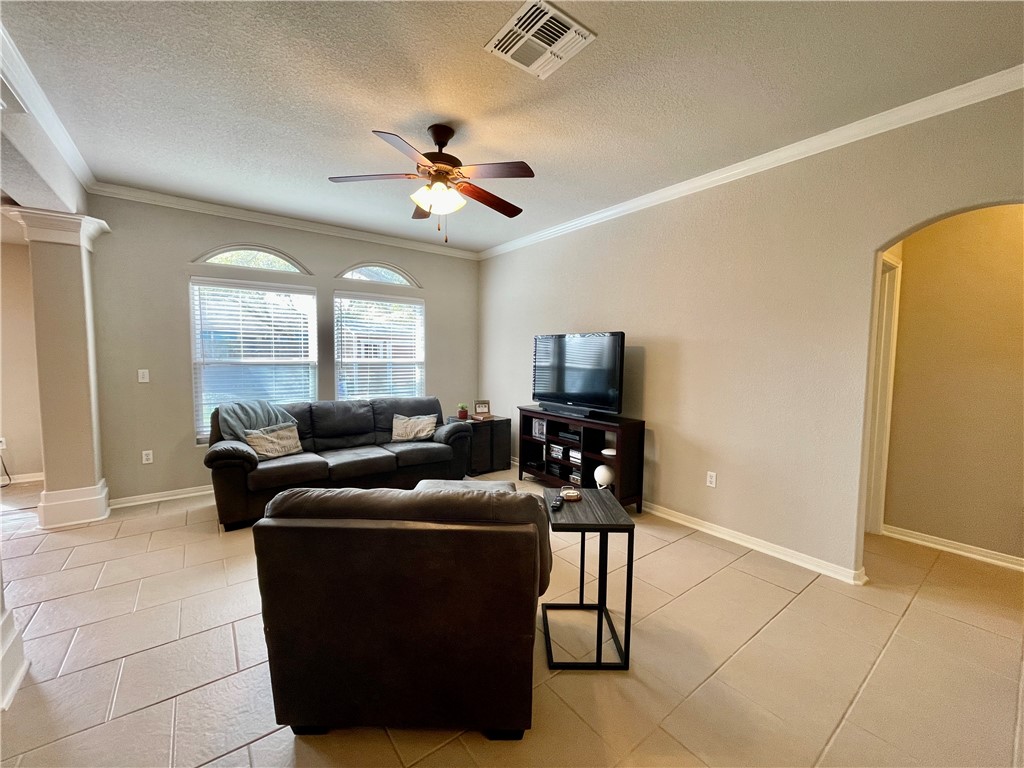 103 Sandollar Circle Fulton, TX 78382 - Photo 5 of 25 a living room with furniture a large window and a flat screen tv