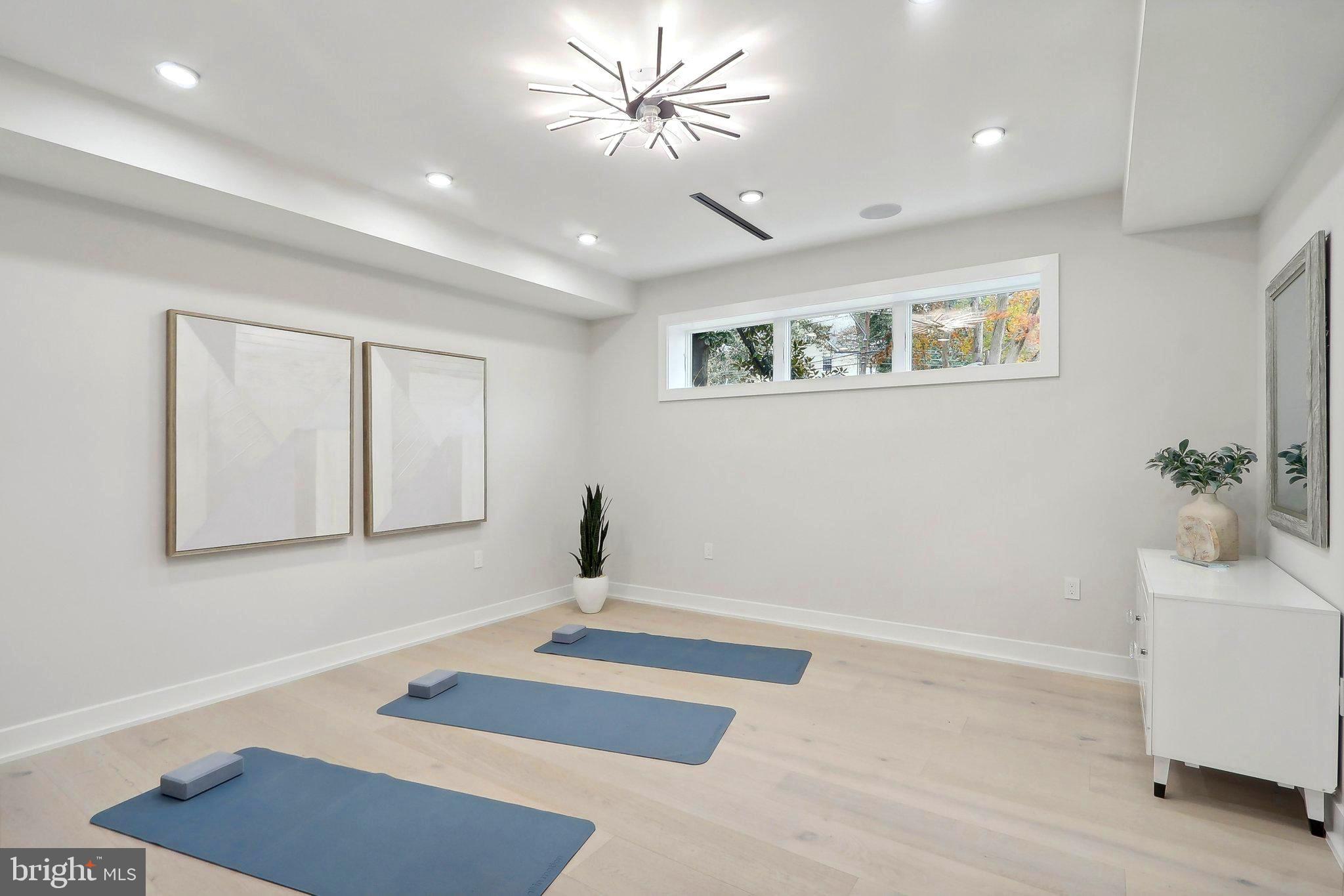4920 Loughboro Road Northwest Washington, DC 20016 - Photo 34 of 41 a very nice looking room with a ceiling fan and a rug