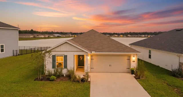 a front view of a house with a ocean view