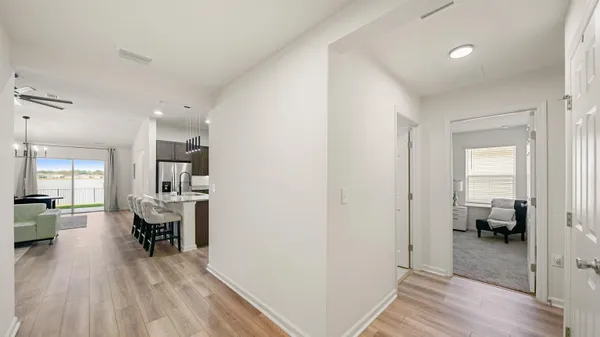 a view of a livingroom with a hardwood floor and a workspace