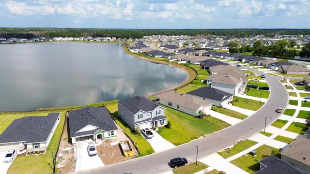 an aerial view of a house with outdoor space
