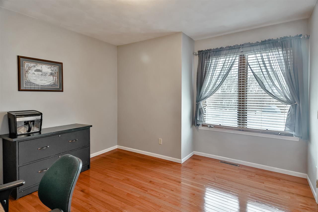 8112 McCurry Road Roscoe, IL 61073 - Photo 20 of 30 a view of a workspace with furniture and a window