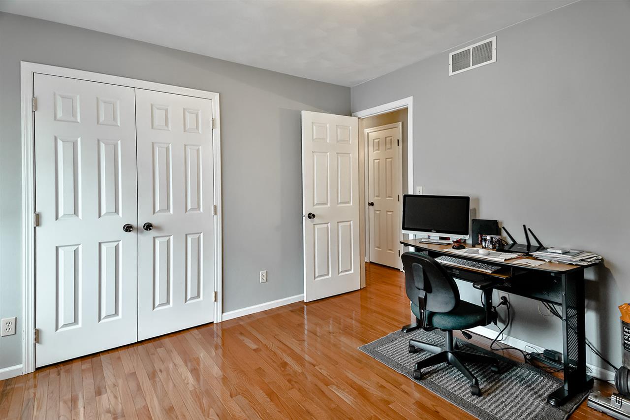 8112 McCurry Road Roscoe, IL 61073 - Photo 21 of 30 a view of a workspace with furniture and wooden floor