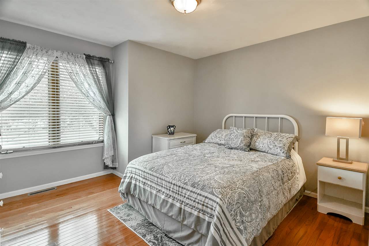 8112 McCurry Road Roscoe, IL 61073 - Photo 22 of 30 a bedroom with a bed and window