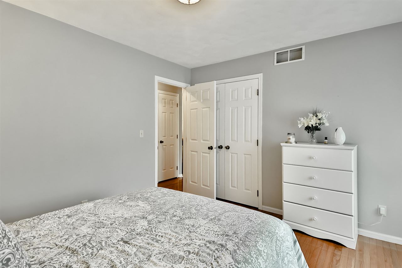8112 McCurry Road Roscoe, IL 61073 - Photo 23 of 30 a bedroom with a bed and cabinet