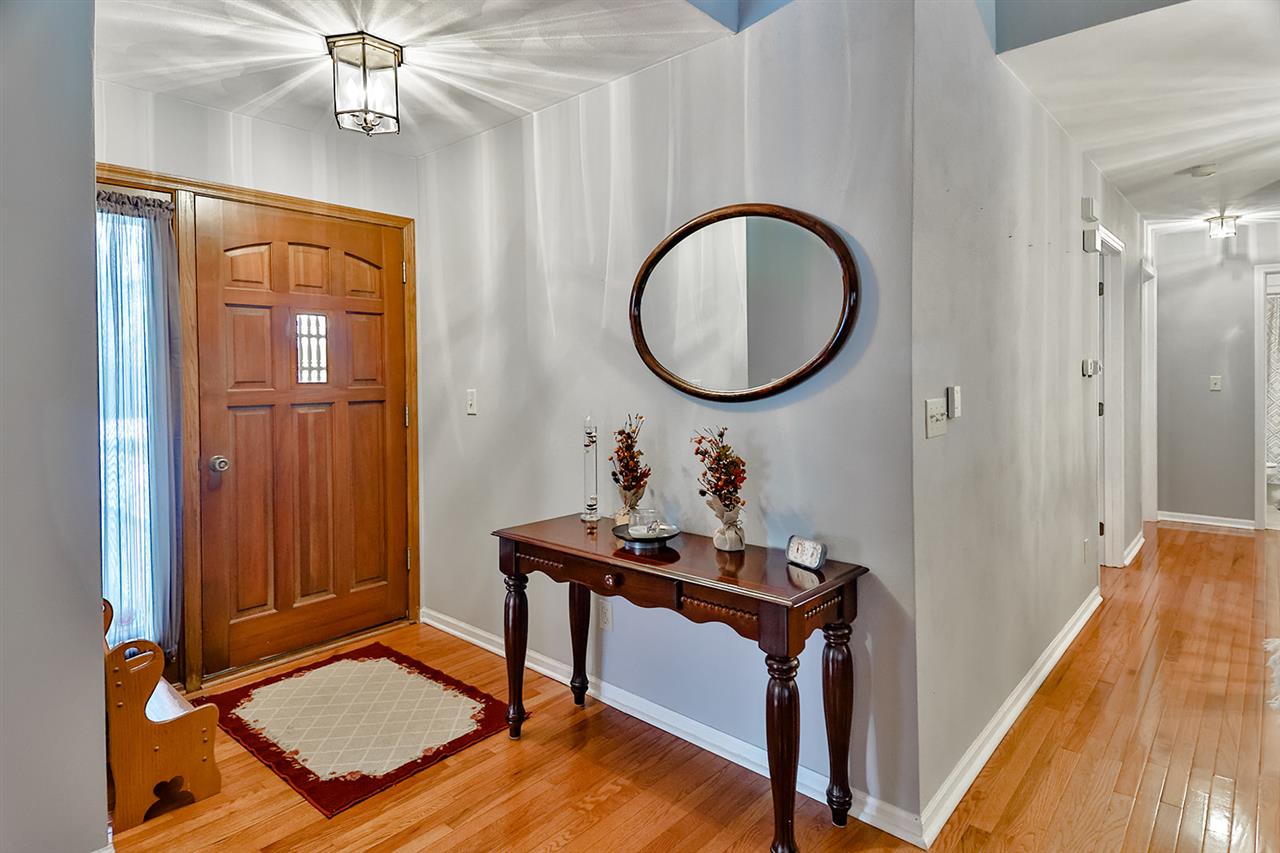 8112 McCurry Road Roscoe, IL 61073 - Photo 7 of 30 a work room with furniture and wooden floor