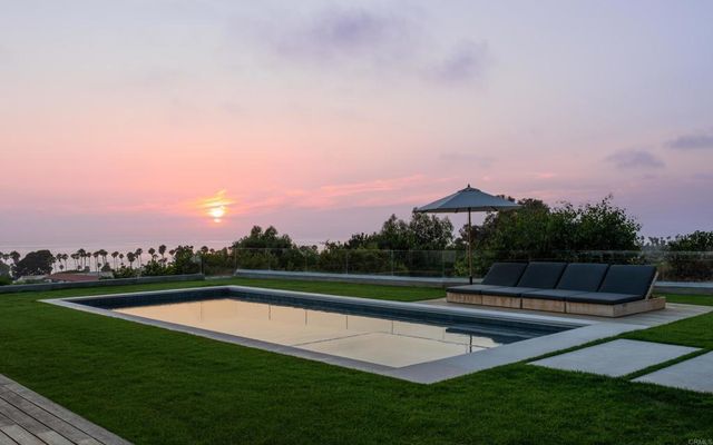 a view of a golf course with a lake