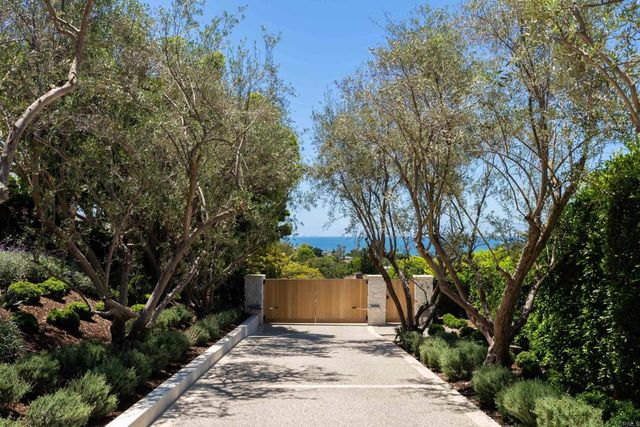 a kitchen that has a sink and a stove in it