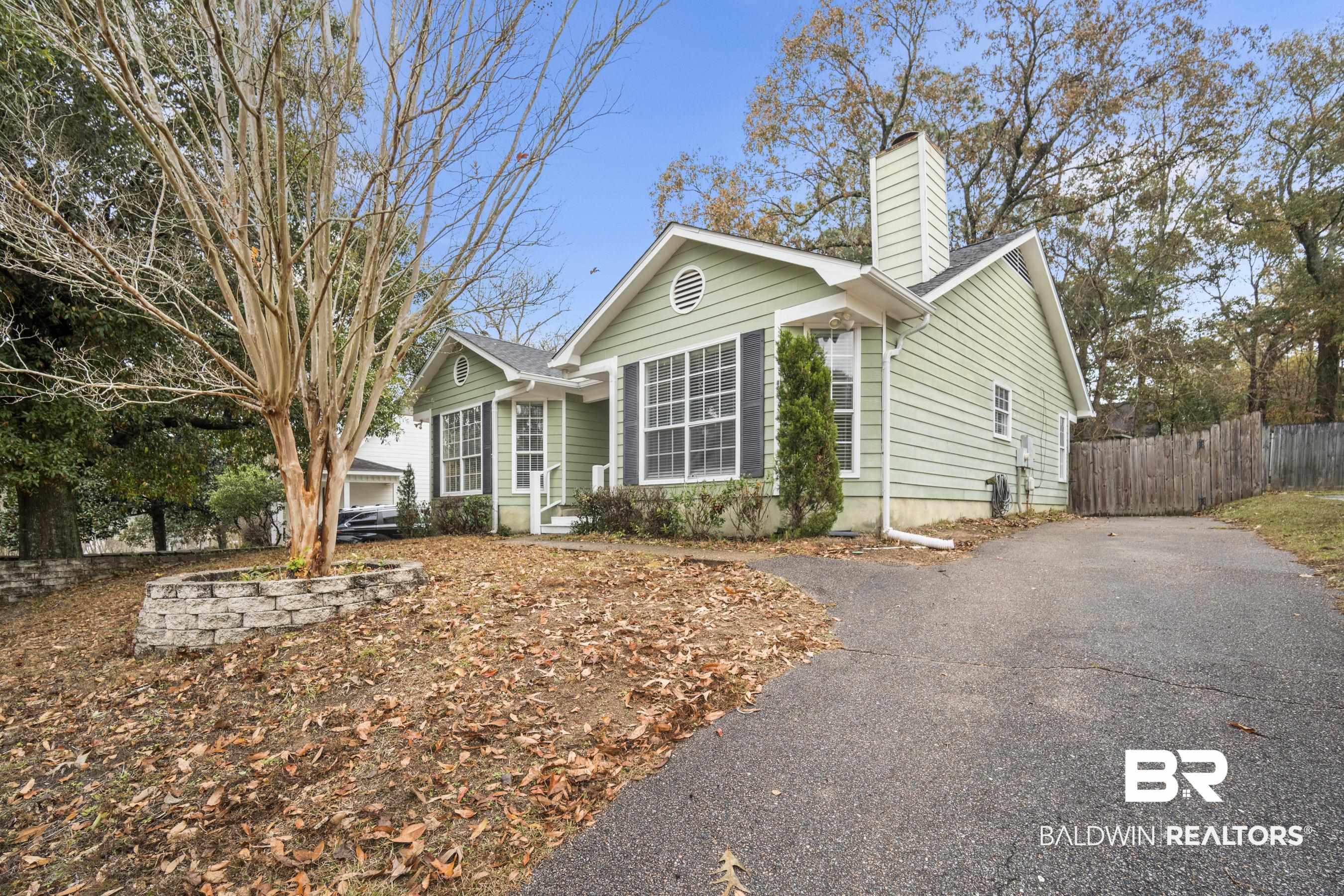 3101 Autumn Ridge Drive West Mobile, AL 36695 - Photo 26 of 36 View of front of property with a chimney and driveway
