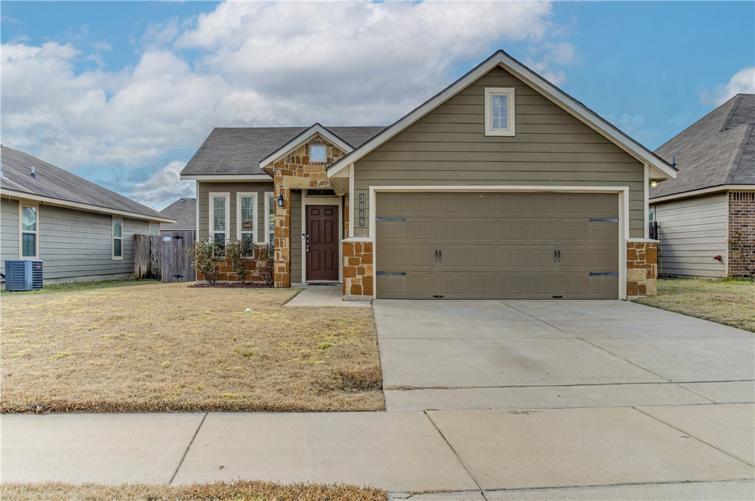 a front view of a house with a garage