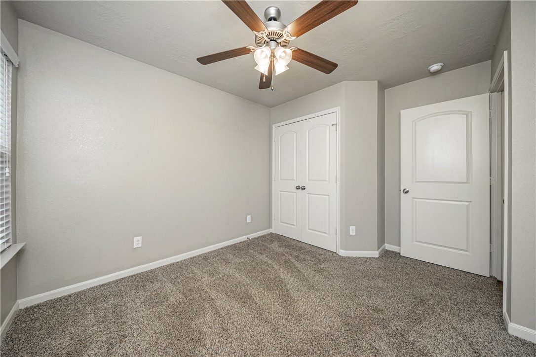 3009 Positano Loop Bryan, TX 77808 - Photo 16 of 21 a view of an empty room and chandelier fan