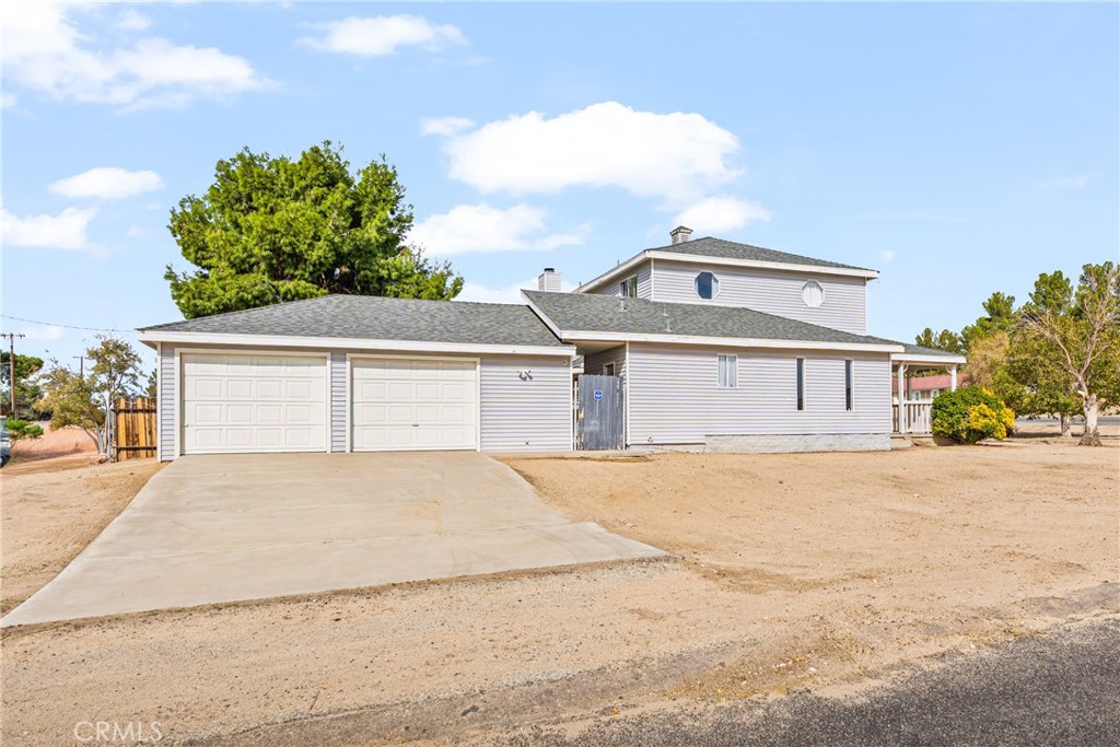 14610 Apple Valley Road Apple Valley, CA 92307 - Photo 43 of 49 front view of a house with a yard