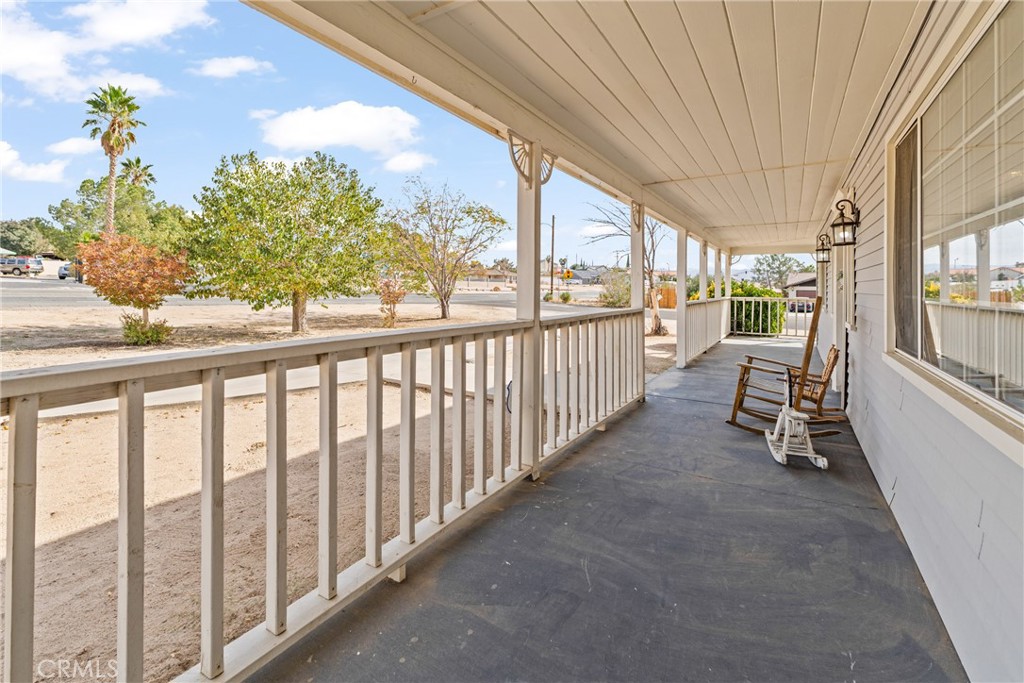 14610 Apple Valley Road Apple Valley, CA 92307 - Photo 5 of 49 a view of a porch with furniture and garden