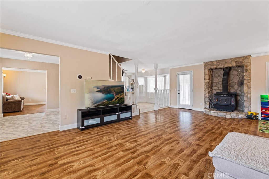 14610 Apple Valley Road Apple Valley, CA 92307 - Photo 9 of 49 a living room with furniture and a wooden floor