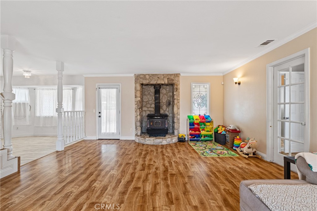 14610 Apple Valley Road Apple Valley, CA 92307 - Photo 10 of 49 a view of a livingroom with furniture wooden floor and a window