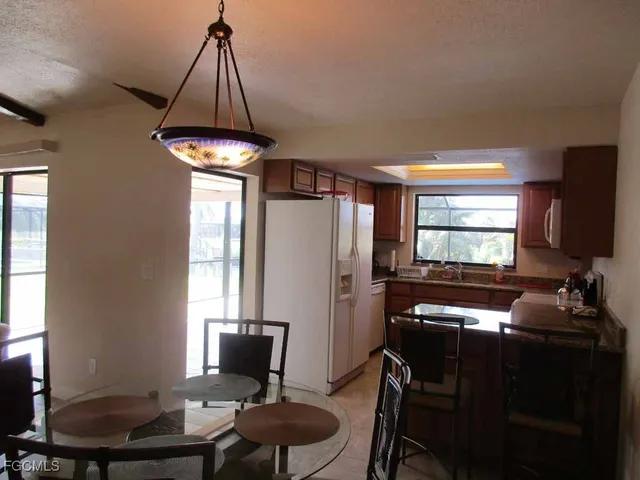 a room with furniture a window and a chandelier