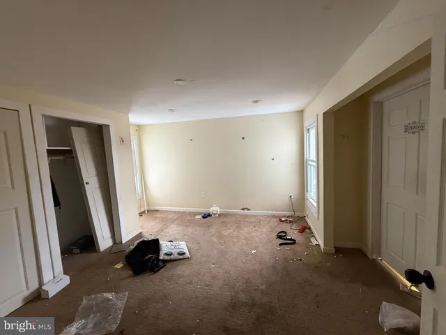 a room with a bed and a window