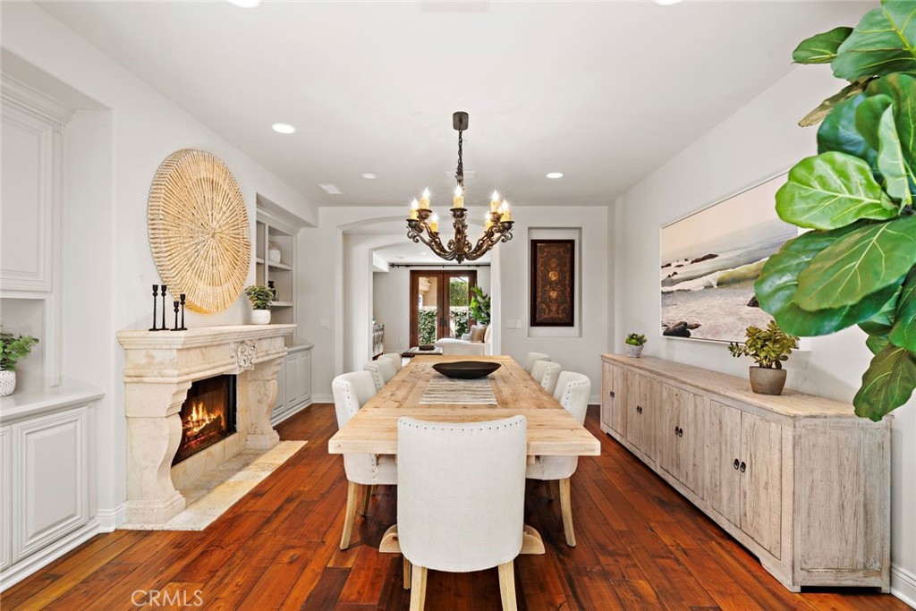 5 Via Monarca Street Dana Point, CA 92629 - Photo 15 of 64 a dining room with furniture a fireplace and a chandelier