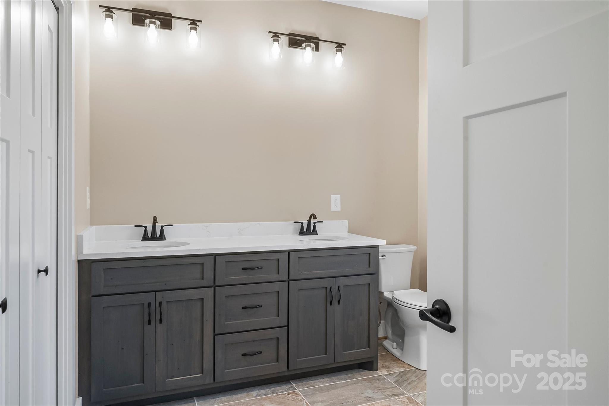 2937 Frank Whisnant Road Morganton, NC 28655 - Photo 12 of 25 a spacious bathroom with a granite countertop sink and mirror