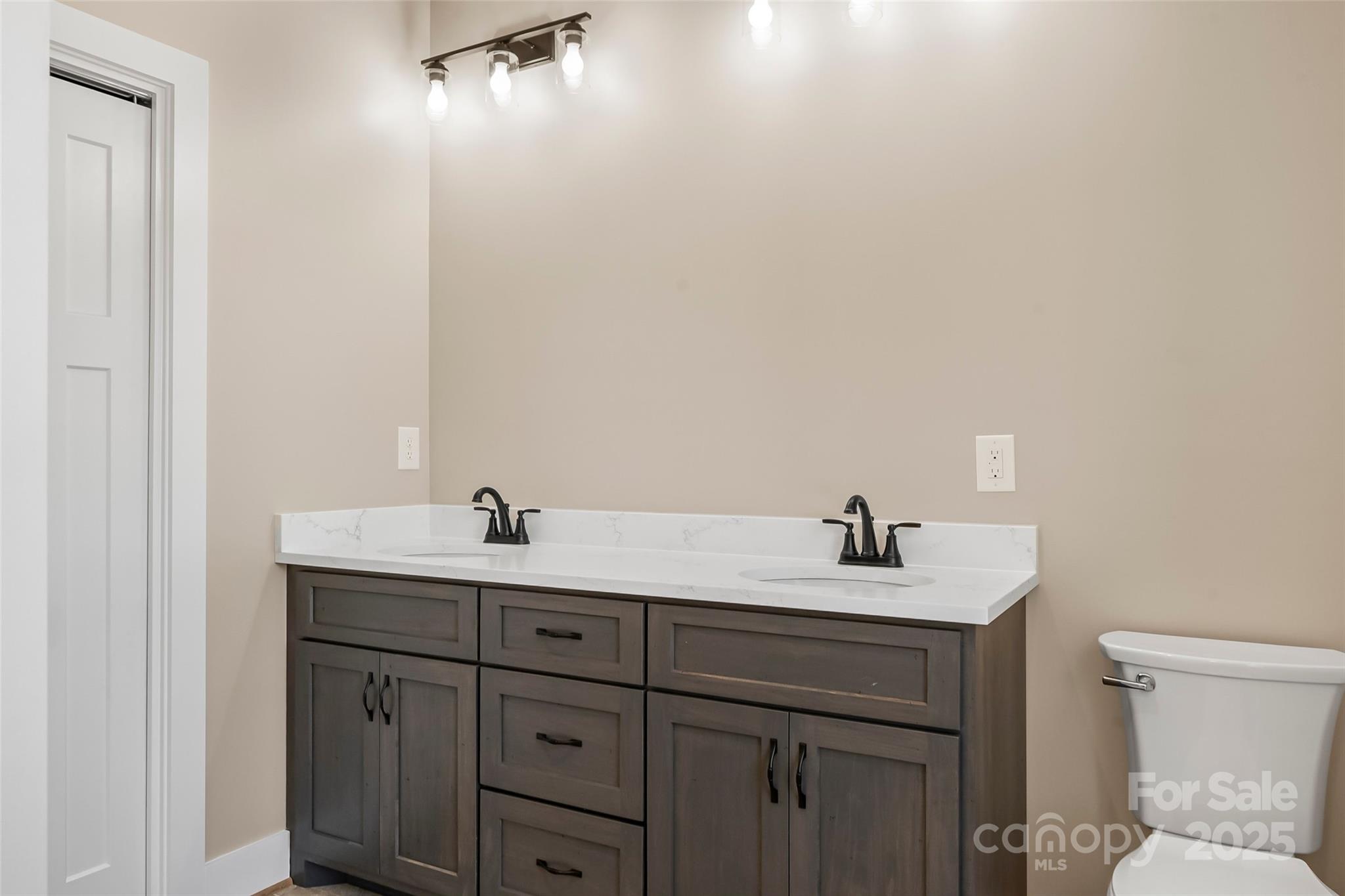 2937 Frank Whisnant Road Morganton, NC 28655 - Photo 13 of 25 a bathroom with a granite countertop sink and a mirror